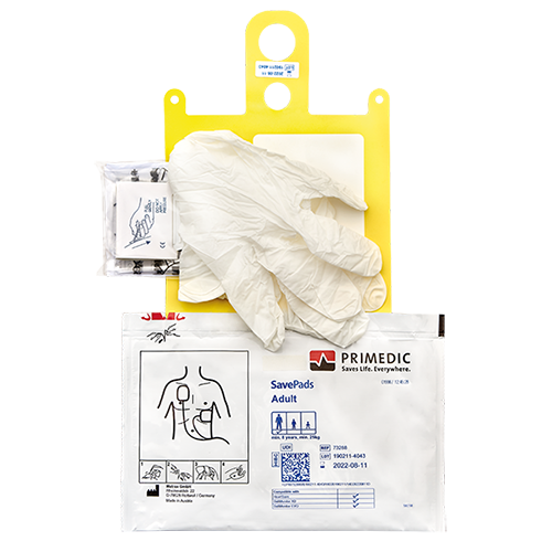 Zubehör für eine Defibrilationsmaßnahme, die aus Handschuhen, Defipats, Kompressen und Kabeln besteht.png